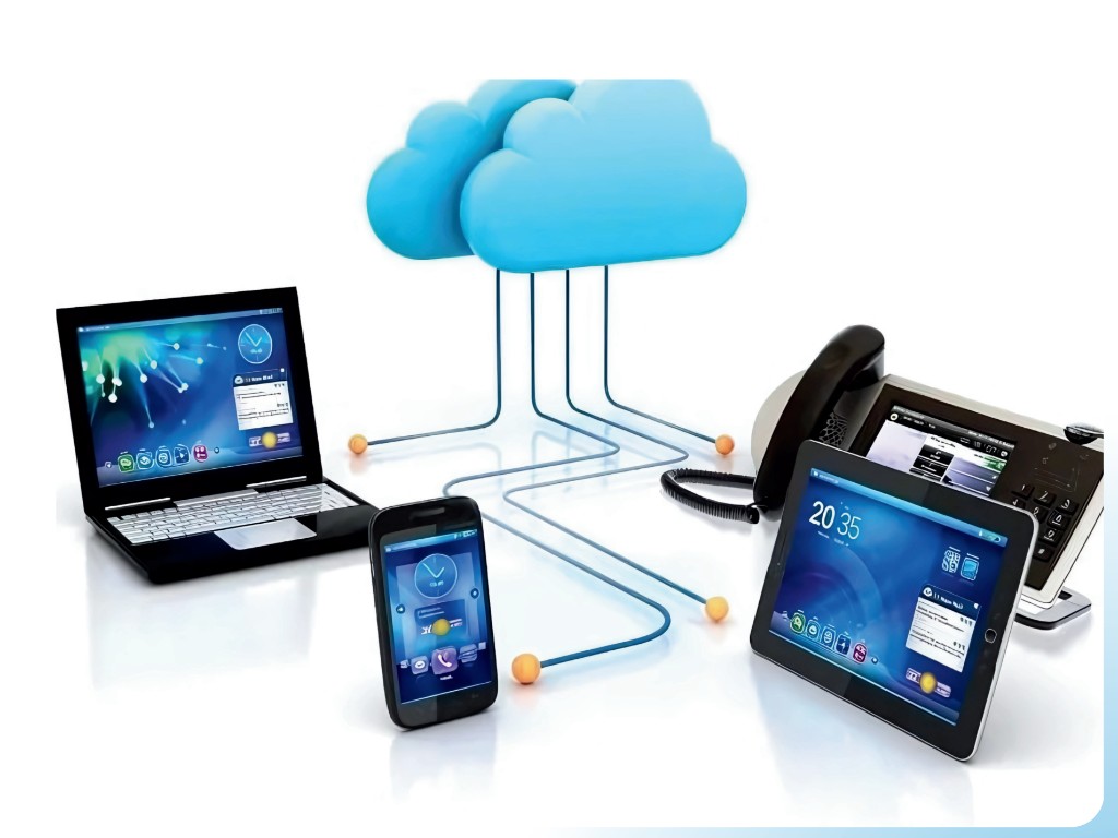 VoIP illustration: cloud connected to laptop, desk phone, tablet, and smartphone — unified communications over the network.